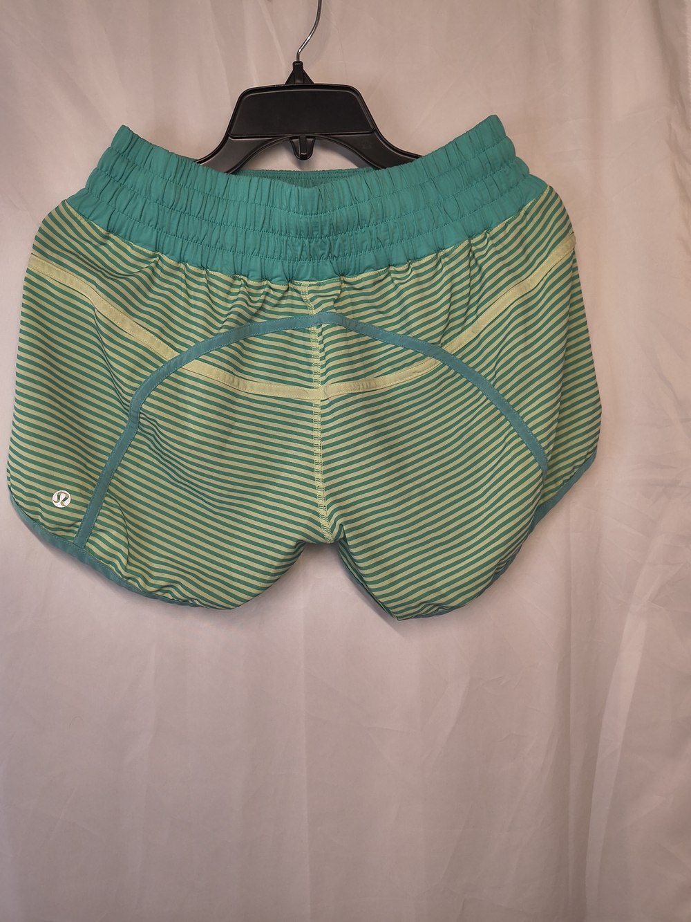 Lululemon Tracker Short II athletic shorts in a green and yellow striped